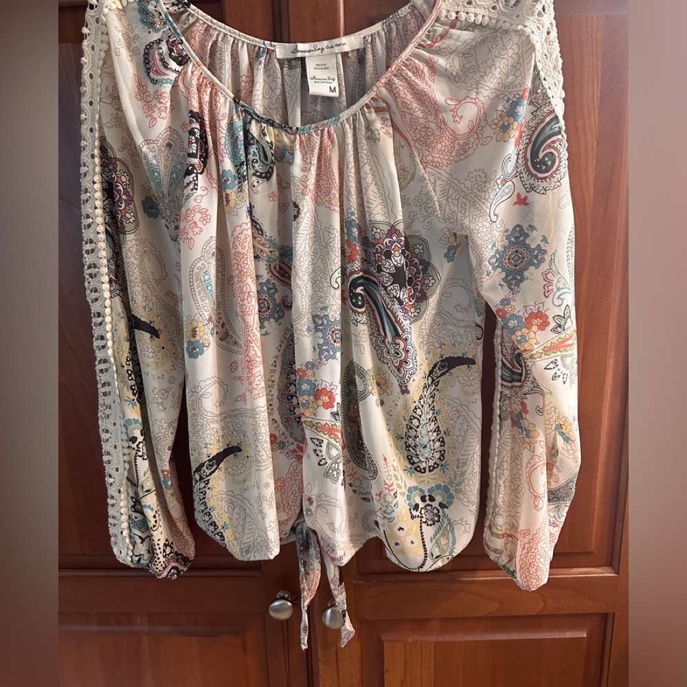 American Rag ladies multi color pull over blouse tie front